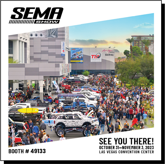 SEMA Banner for Excel Tire Booth #49133 with People & Cars in the Background